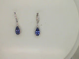 14kt. white gold pear shaped Tanzanite and diamond halo drop earrings