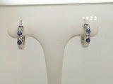 14Kt. White Gold 1.10ctgw Natural Round Diamond And Genuine Blue Sapphire Vault Lock Huggie Earrings