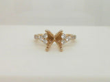 14kt. Yellow Gold 3/8ctdw. Natural Round Diamond Three stone cluster semi mount for a 2ct. oval